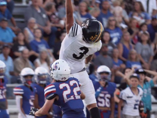 Lobo #3 Laike Kennedy reaching for the football last Friday in Coleman. Cisco Loboes won by a score of 35 to Coleman 22.