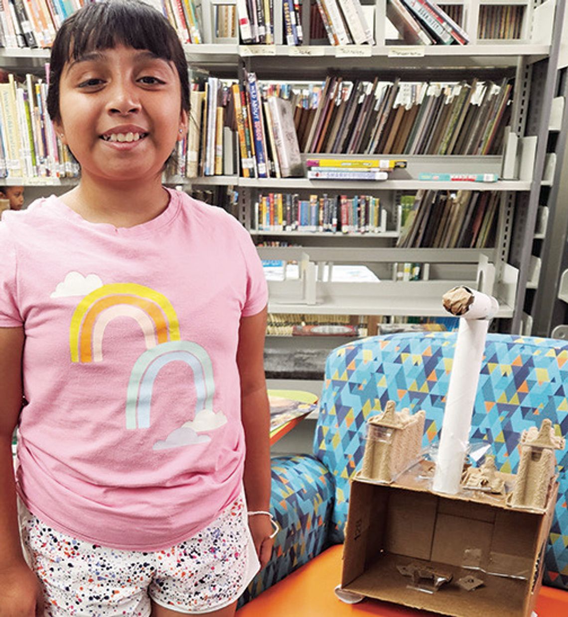 A student displays her self-made creation at Eastland Library’s summer program